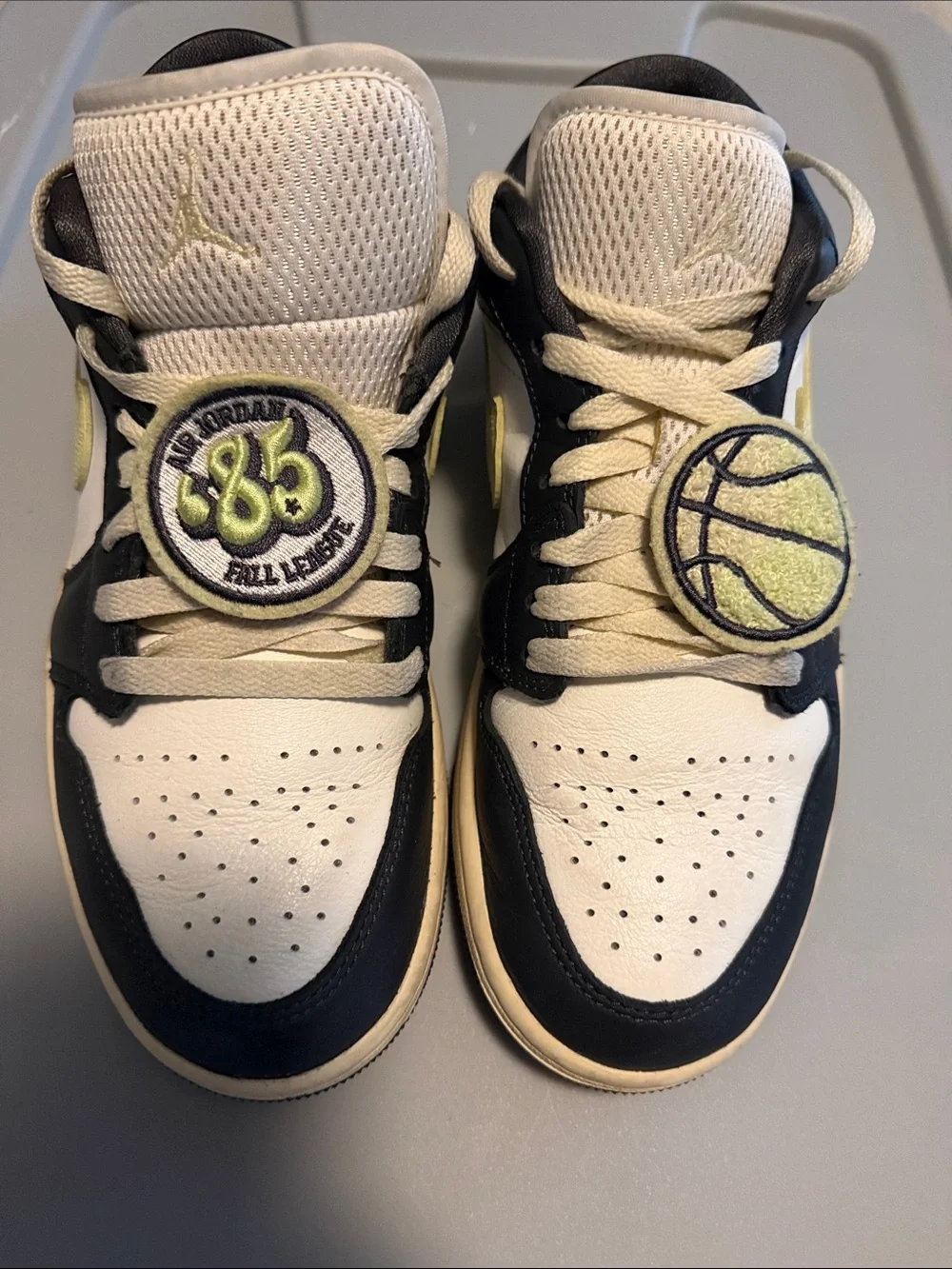 Nike Air Jordan 1 Low in White, Black and Cream/Yellow Accents